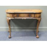 A George II style crossbanded walnut breakfront sidetable, the single frieze drawer over acanthus