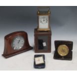 A pair of Swiss travel alarm clocks together with a pair of 8 day repeater travel clocks, all in