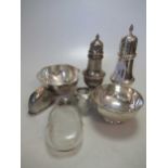 A collection of silver including a cased enamel and silver dressing table set, two silver sugar