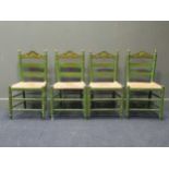 A set of four Continental green and gilt painted chairs with rush seats (4)
