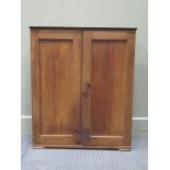 An early 20th century oak two door cabinet, 81 x 68 x 21cm