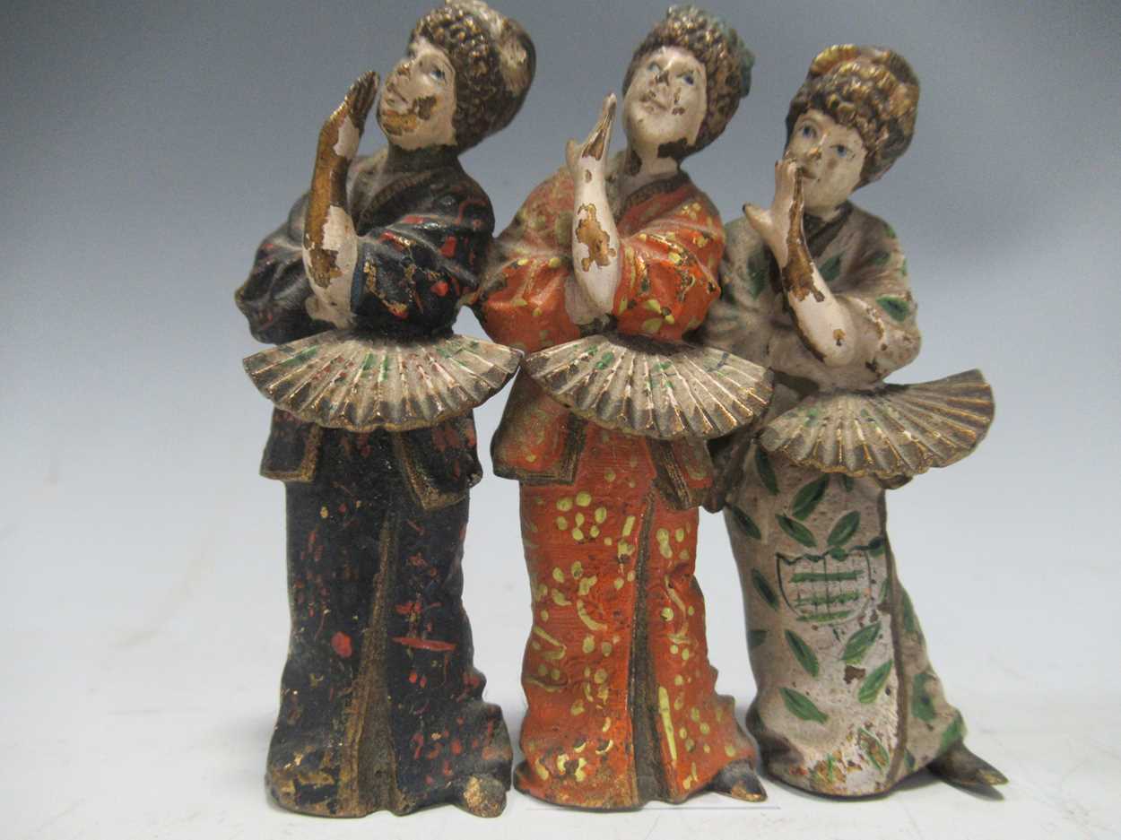 A cold painted metal model of three Geisha girls