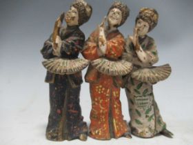 A cold painted metal model of three Geisha girls