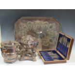 A large collection of silver plated items including meat domes, wine coolers, tray, kettle and