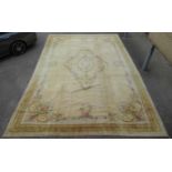 A large Aubusson style carpet, 604 x 394cmFading to colour commensurate with age and use. Some minor