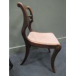 A pair of Regency rosewood bar back chairs with brass inlay on sabre legs (2)