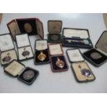 A collection of medals and medallions, associated with the Confectioners, Bakers and Allied