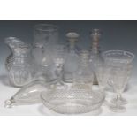 Various cut glass decanters and other glass ware including a bowl, wine glasses, jug and vase