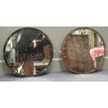 A pair of circular wall mirrors, 51cm diameter