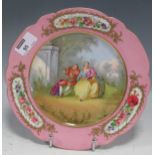 A Sevres 'Chateau des Tuileries' porcelain plate decorated with a fête galante style scene