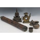 A collection of decorative items to include a stupa, a toroidal ‘doughnut’ teapot, a Ghanta