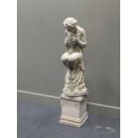 A composite stone garden statue of Bacchus, on an associated plinth, total height -