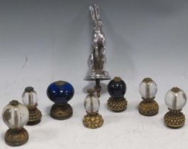 A metal rabbit hood ornament together with a collection of modern glass kalashes