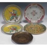 A collection of import plates to include one lacquer and gilt plate depicting palace scene, a pair