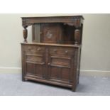 A 17th century style reproduction oak court cupboard, 137.5 x 122 x 49cm