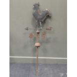 A metal cockerel weather vane, 137cm high, two metal wall sconces and a wall mounted bell