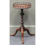 A small 19th century tripod table with galleried top, 57cm high and 29cm diameter