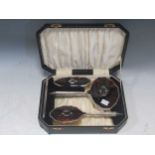 Tortoiseshell backed silver 4 piece dressing table set, cased, early 20th century