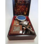 A collection of silverware and objets including a silver cigarette case, a base metal cigarette case