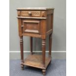 A carved oak bedside cabinet with rouge veined marble top, 87 x 39 x 37cm
