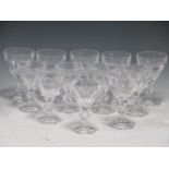 A collection of twelve baccarat style cut glass wine glasses, comprising six white wine and six