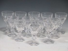 A collection of twelve baccarat style cut glass wine glasses, comprising six white wine and six