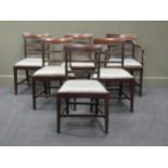 A set of six Regency mahogany dining chairs with bar backs, reeded midrails and drop in seats