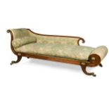 A Regency faux-rosewood and gilt metal mounted chaise lounge, the scroll ends and back raised on