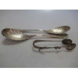 A pair of Victorian silver salad servers, together with a par of Art Nouveau silver sugar nips by
