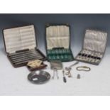 A silver cigarette case, a silver dish, cased cufflinks and dress studs, three cased sets of