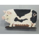 A painted wood sow fret cut wall hanging board