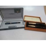 A parker fountain pen with an '18K' nib, cased, together with a parker fountain pen (AF) and pencil,