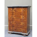 A 19th century German walnut and ebonised cupboard, the hinged door modelled as 4 faux drawers, 81 x