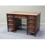 A Shapland & Petter of Barnstaple oak twin pedestal desk of nine drawers, 76 x 122 x 68cm