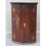 A 19th century mahogany bow front corner cupboard, 105 x 70 x 48cm