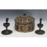 A pair of Indian style candlesticks together with a lidded wooden pot decorated with Buddhist