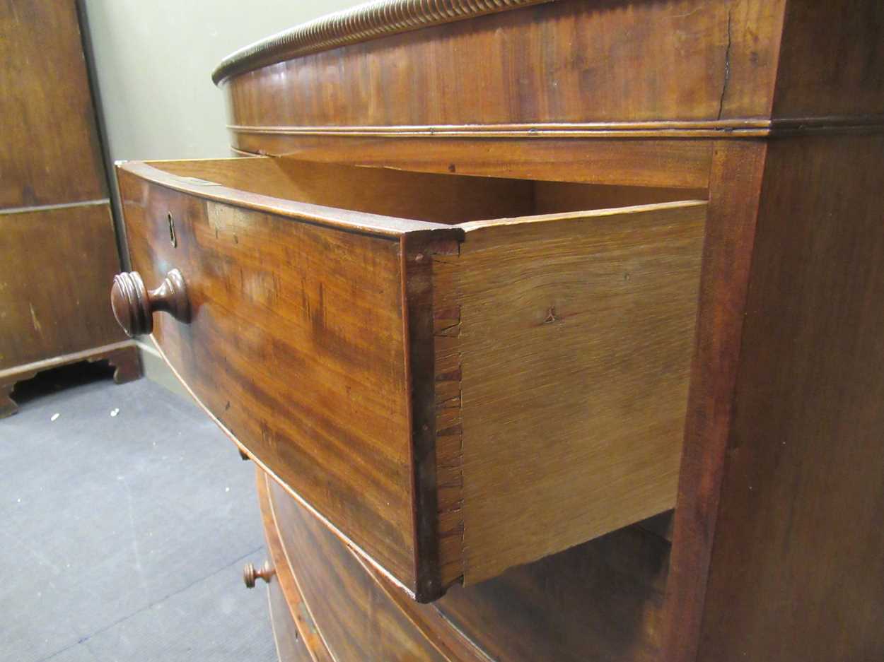 A Victorian bow fronted chest of drawers, with two short over three graduating long drawers, with - Image 9 of 9