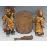 A pair of gilt statuettes, an ornately carved miniature chillum and a carved wooden dish depicting