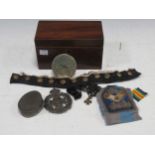 A collection of military items to include a shagreen compact with the RAF insignia, a group of brass