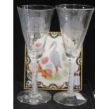 A pair of modern opaque twist stem 'Yorkshire rose' wine glasses, 22.5cm high; and a Minton