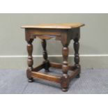 A 17th century style oak stool with turned legs, 48 x 45 x 29.5cm
