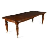 A Victorian style mahogany extending dining table, 20th century, with two additional leaves, the