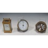 A 20th century gilt brass carriage timepiece, a brass aneroid barometer, and a battery clock