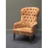 A button-back armchair on turned front legs and brass castors, 103cm high together with an Edwardian