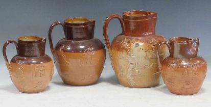 Four 19th century Doulton Lambeth salt glazed stoneware jugs with hunting relief decoration, largest