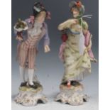 A pair of Dresden type porcelain figures of a gallant and his lady companion, probably Volkstedt,