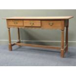 An 18th century style pine three drawer dresser base, 89.5 x 173 x 55cm