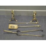 A set of brass fire dogs and tongs, to include shovel, tongs, and poker (5)Provenance:Wood Hall,