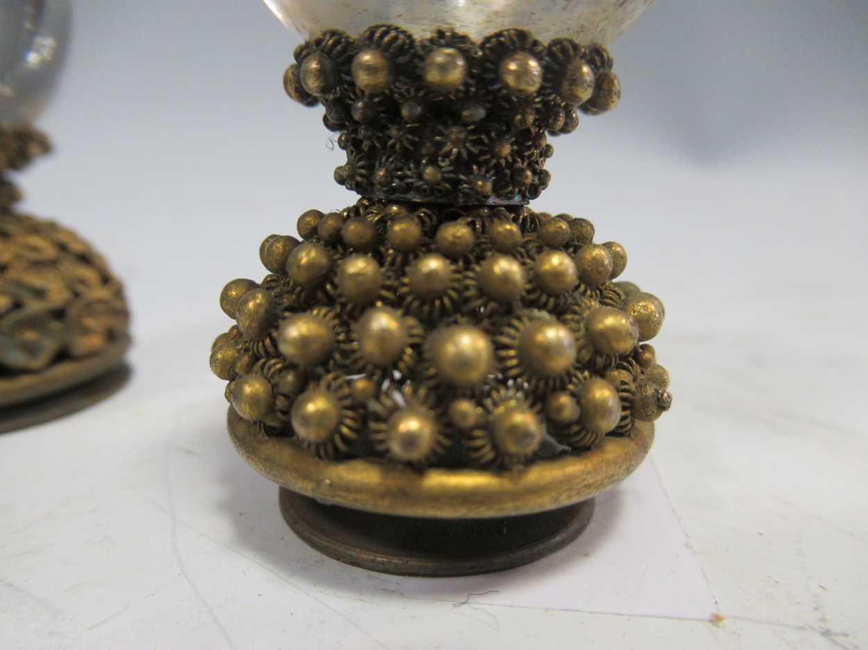 A metal rabbit hood ornament together with a collection of modern glass