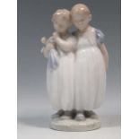 A Royal Copenhagen group of two children in nightdresses, signed by Christian Thomsen, 16.5cm high